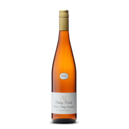 Alt text: "A sleek bottle of Oaky Creek Hunter Valley Semillon 2022 wine, displaying a clear, amber-hued liquid. The label is elegant and minimalistic, with the name 'Oaky Creek' in stylish script above 'Hunter Valley Semillon' and the subtitle 'by Glover Wines'. The year '2022' is highlighted in a small circular emblem at the top, and the bottle is sealed with a gold-colored screw cap, all against a white background.