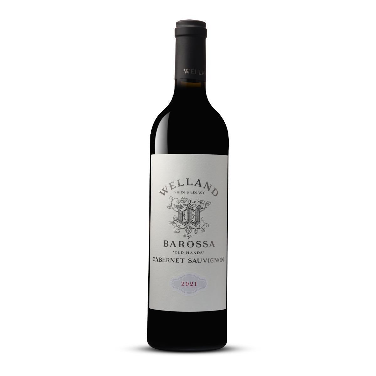 Image of a wine bottle with a label that reads 'WELLAND, BAROSSA, KRIEG'S LEGACY, "OLD HANDS" CABERNET SAUVIGNON, 2021'. The bottle is dark, suggesting a rich red wine within, and it has a grey screw cap. The label is white with a traditional crest and two lions in the centre, lending a classic and prestigious feel. The winery's name 'WELLAND' is at the top in bold black letters, and 'BAROSSA' is prominently displayed underneath. 